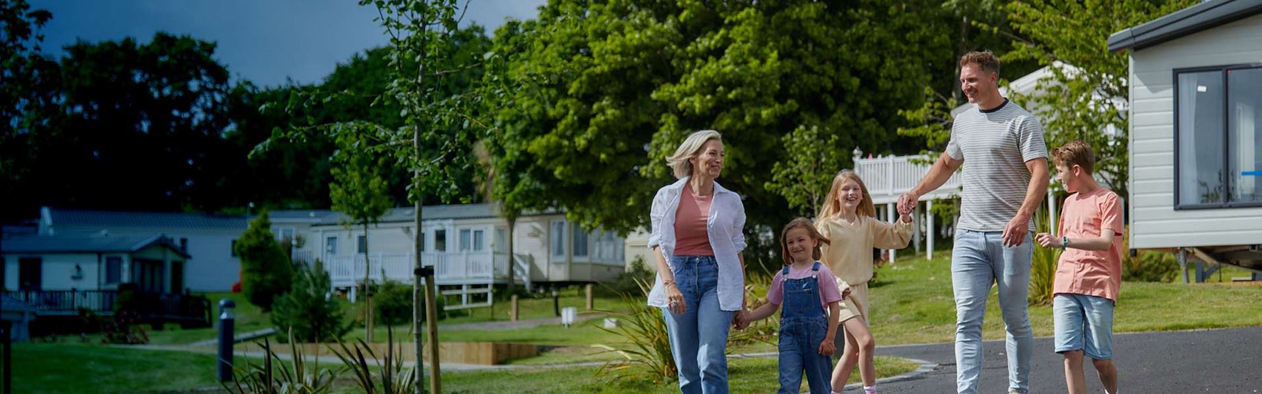 family walking down a path at a holiday park