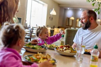 Family eating a hearty meal at Parkdean Resorts