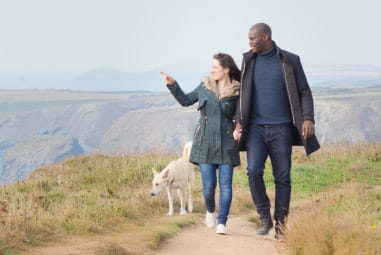 Couple walking along the beach