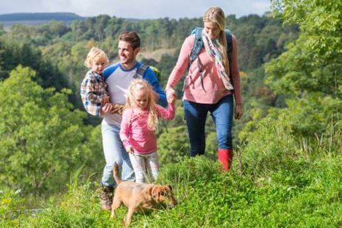 Family walking with dog