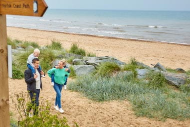 Family walking along the beach
