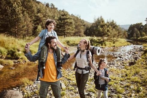 Family walking smiling