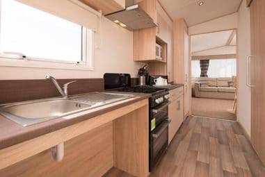 Inside the kitchen of an accessible accommodation showing the lowered counter tops
