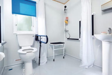 The accessibility features and spacious shower area in an accessible accommodation