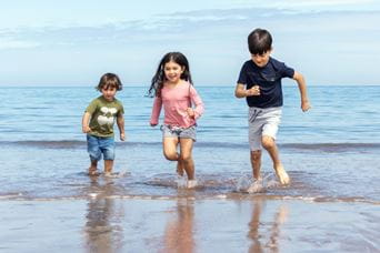 Kids running in the sea