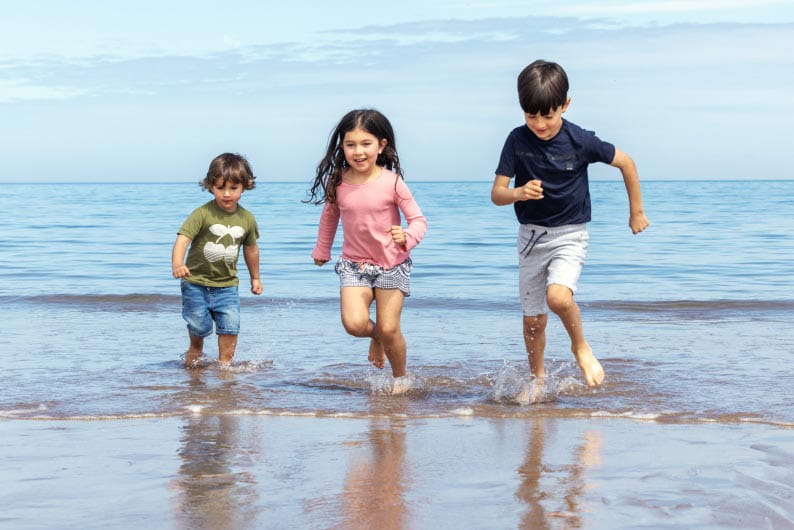 Kids running in the sea
