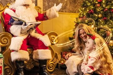 Father Christmas with mum and daughter
