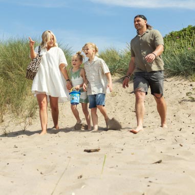 Family walking along the beach
