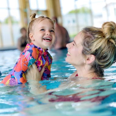Mum and daughter in the pool