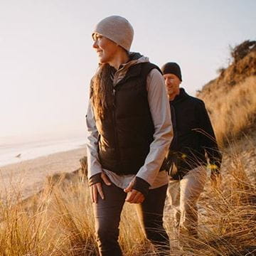 Couple walking on hill