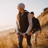 Couple walking on hill