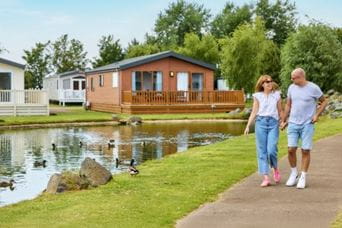 Couple walking by lake