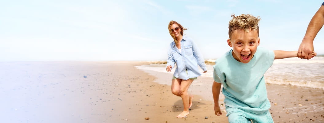 Family playing on the beach