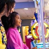 Child playing in arcade