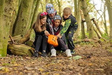 Children in the woods in fancy dress