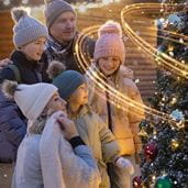 Family by Christmas tree