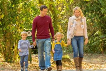 A family on an autumn walk in the woods