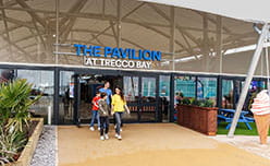 Trecco Bay hero image of a family walking out of the pavilion