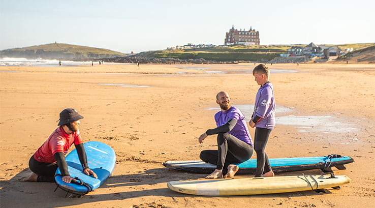A surfing lesson on Fistral Beach in Cornwall
