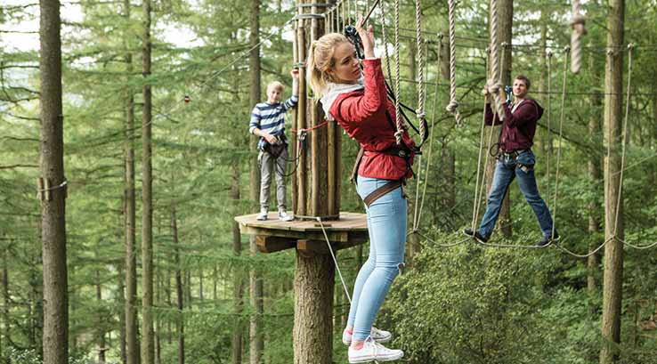 Kids walking along tight ropes