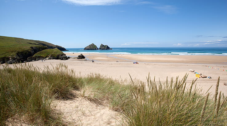 Sand dunes of Holywell beach on a sunny day