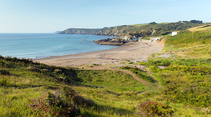 a deserted kennack sands on a sunny day