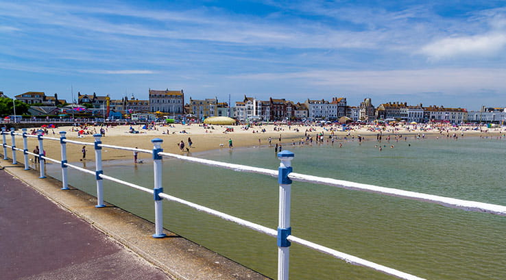 looking over to weymouth beach from a path on the sea front