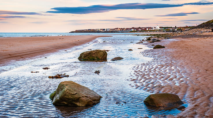 Rocks on the sand at Whitley Bay Beach