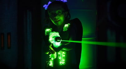 child firing a laser gun