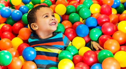 boy in a ball pit