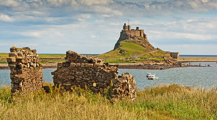 A view from across the water of the Holy Island of Lindisfarne, Northumberland