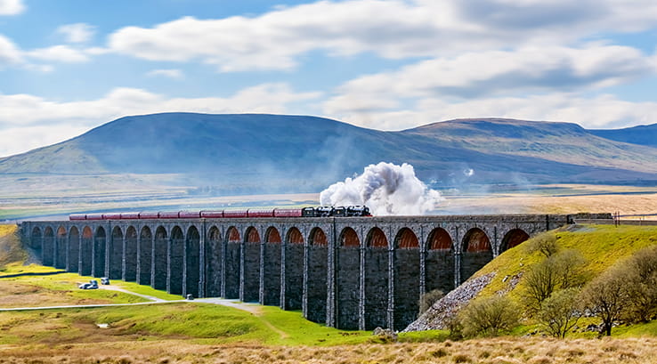 A train making its way across the Ribblehead Viaduct 