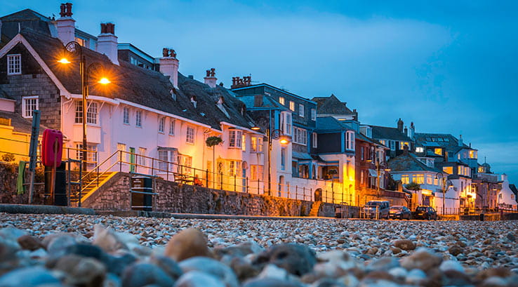 lyme regis beachside houses lit up at night