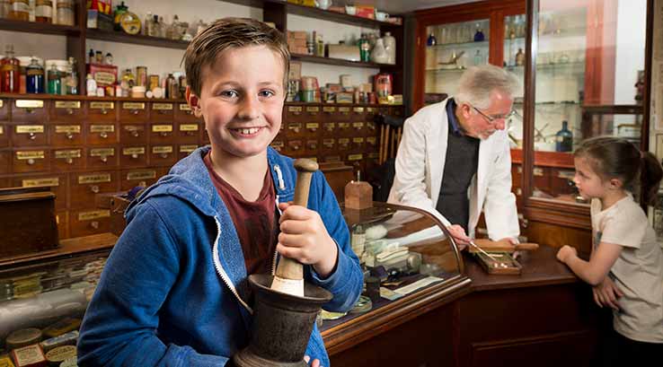 A boy smiling at the camera at Beck Isle Museum