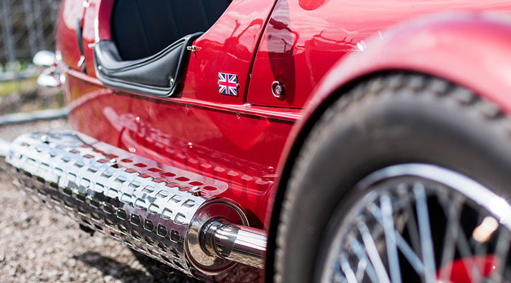A close up of a classic British car