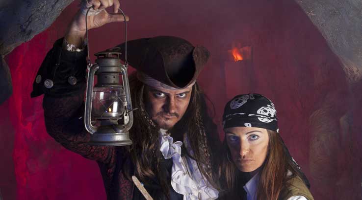 two pirates holding a lamp