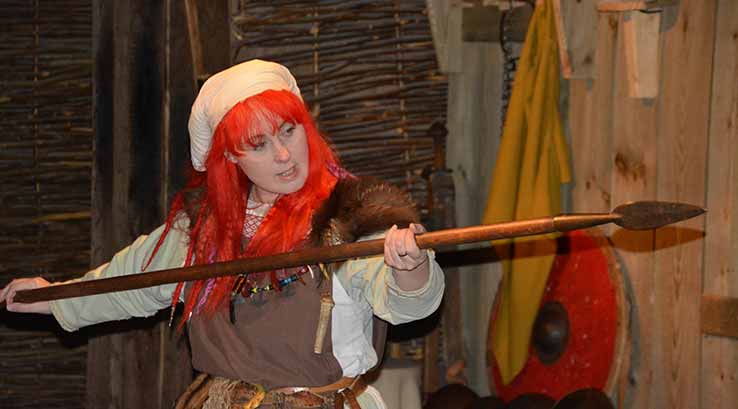 Old viking woman holding spear