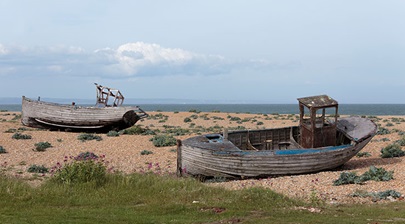 Boats on the shingle beach at Dungeness National Nature Reserve