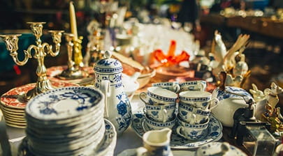 An antique tea set and candlesticks