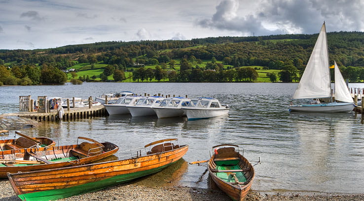 Rowing boats and motor boats docked on Coniston Water
