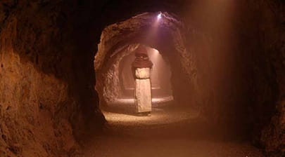 Man walking through King Arthur's Labyrinth