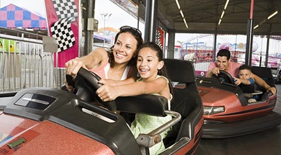 Two people enjoying a bumper car ride