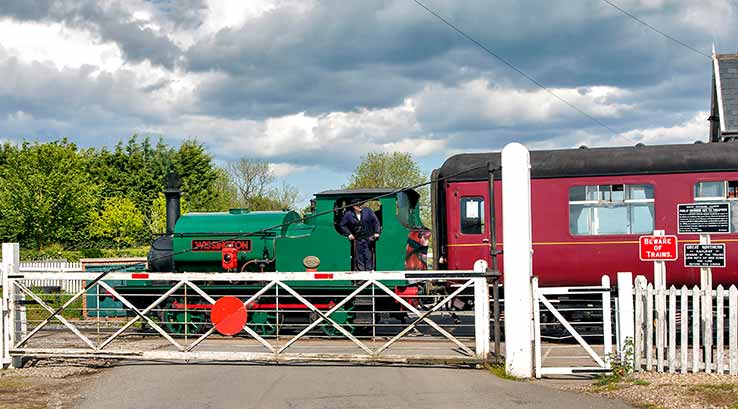 steam train at a level crossing