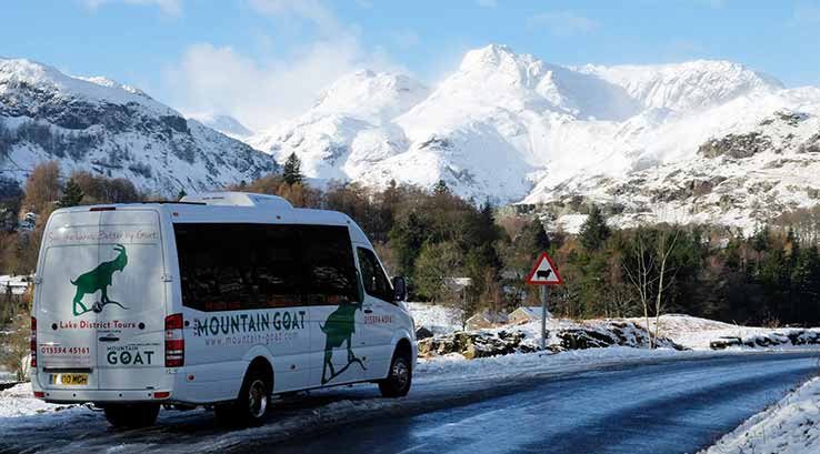 Tour driving through snowy mountains