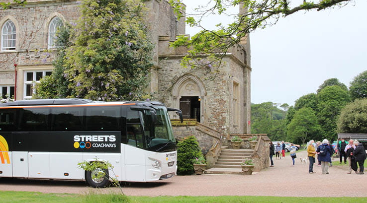 Coach collecting people at historic attraction