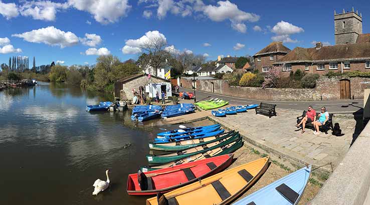 sea kayaks lined up for hire