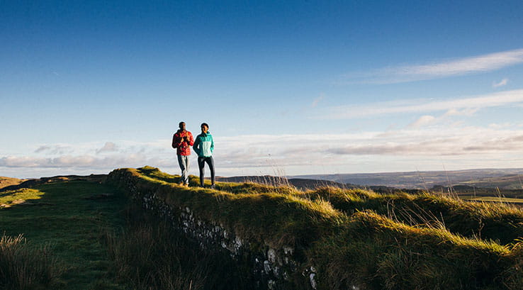 A couple walking along Hadrian's Wall, Northumberland