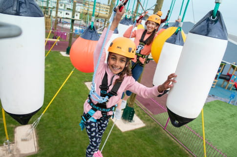 Little girl on the high ropes at Parkdean Resorts