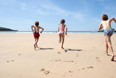 kids running on beach