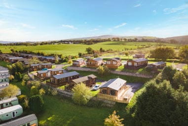 a caravan park nestled in green countryside